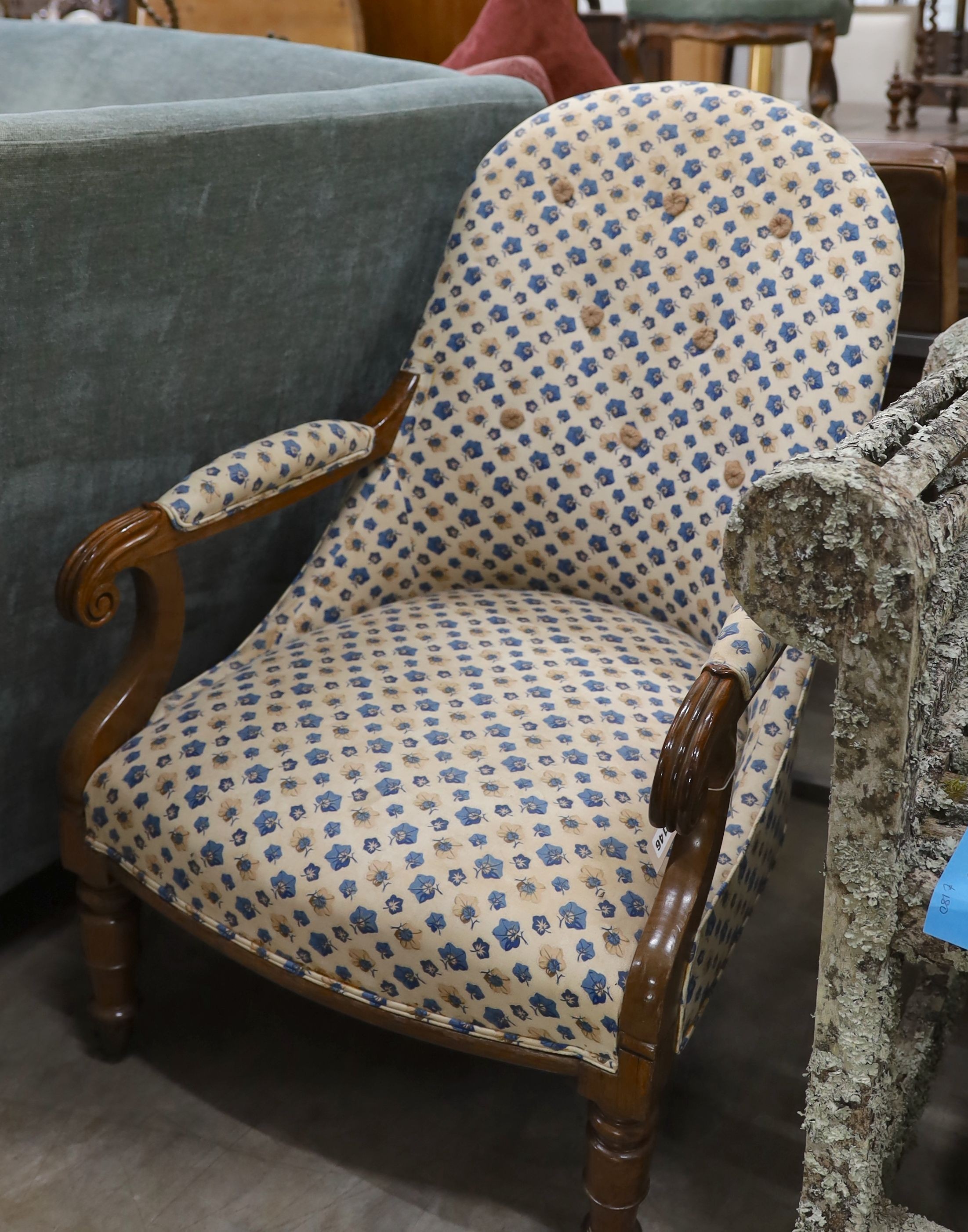 A Victorian walnut spoon back open armchair, width 60cm, depth 58cm, height 93cm